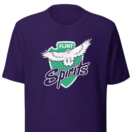 A dark purple short-sleeve t-shirt featuring a vintage-style graphic of a white eagle inside a green shield with the text 'FLINT Spirits' in white and green.