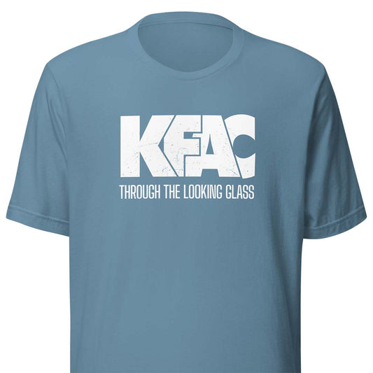 A dusty blue short-sleeve t-shirt with a white distressed graphic on the chest reading 'KFAC' and 'THROUGH THE LOOKING CLASS'.