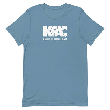 A slate blue short-sleeve crewneck t-shirt with a white graphic print on the chest reading 'KFAC THROUGH THE LOOKING GLASS'.