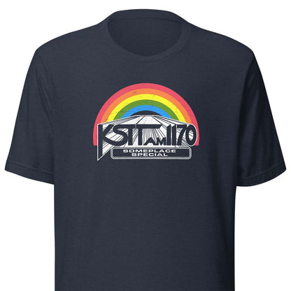 A navy blue short-sleeve t-shirt with a graphic on the chest featuring a rainbow arch over a mountain and the text 'KSTT AM 1170' and 'SOMEPLACE SPECIAL'.