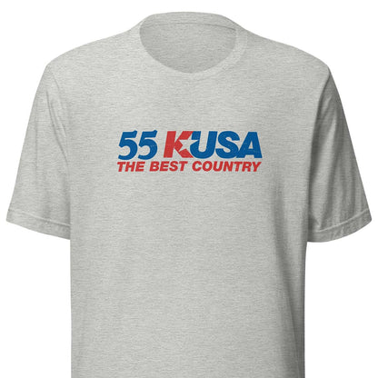 A light heather gray short-sleeve t-shirt with a graphic on the chest reading '55 KUSA THE BEST COUNTRY' in blue and red text.