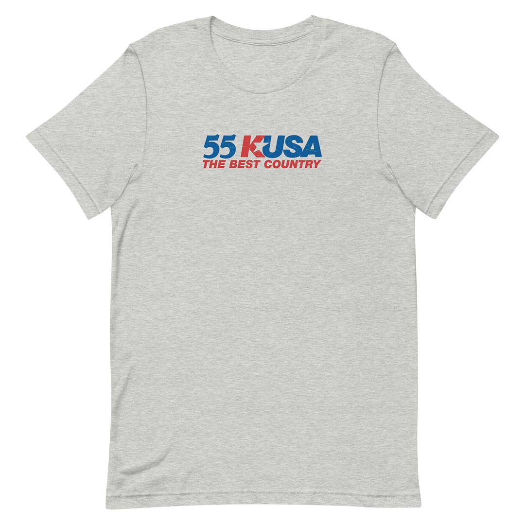 A light heather gray short-sleeve t-shirt with a '55 K-USA THE BEST COUNTRY' graphic printed on the chest in blue and red, displayed on a clean white background.