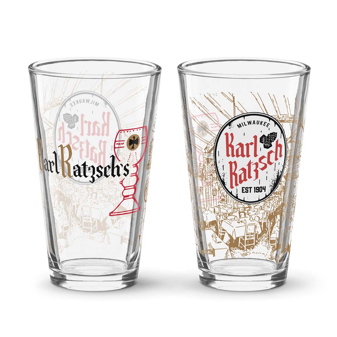 Two clear pint glasses with vintage-style printed graphics of Karl Ratzsch's Milwaukee, shown side by side on a white background.
