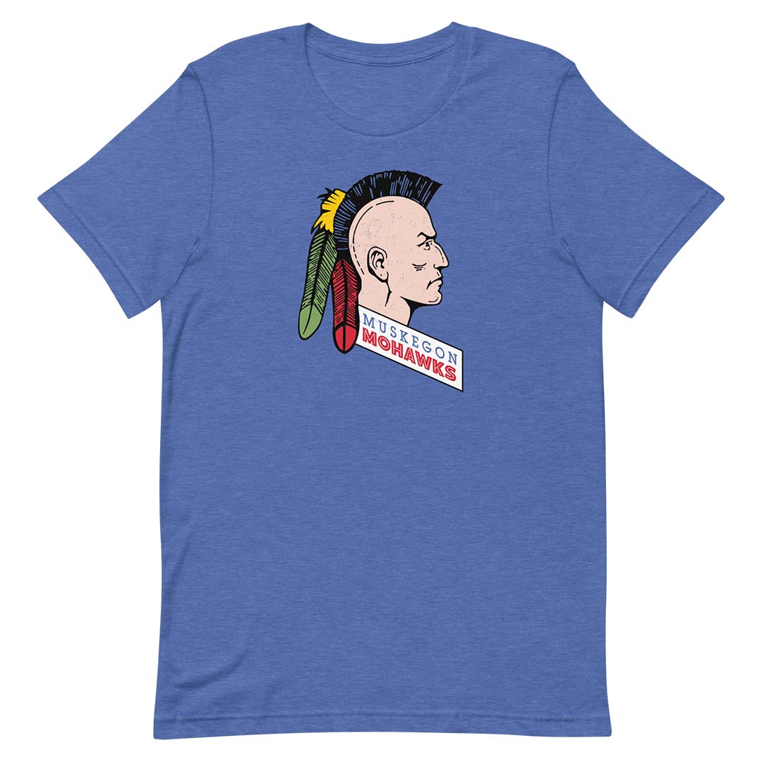 A heather blue short-sleeve t-shirt featuring a graphic of a Native American profile with a mohawk and feathers, and the text 'Muskegon Mohawks' printed on the chest.