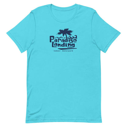 A turquoise blue short-sleeve crewneck t-shirt featuring a dark navy graphic on the chest with a palm tree and the text 'Paradise Landing' and 'Indoor Waterports'.