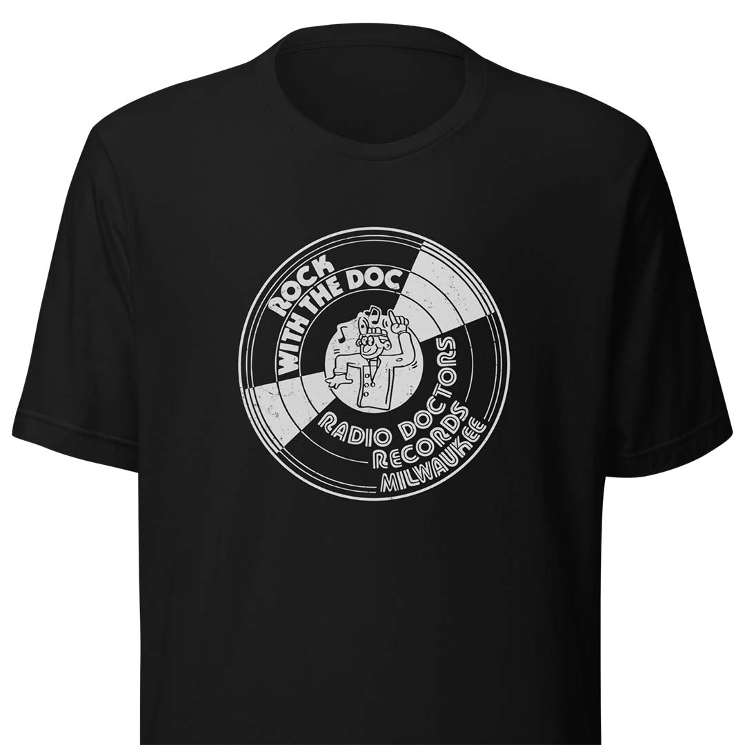 A black short-sleeve crewneck t-shirt featuring a circular white graphic print on the chest with the text 'ROCK WITH THE DOC RADIO DOCTORS RECORDS MILWAUKEE' and an illustration of a radio station.