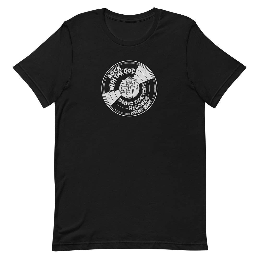 A black short-sleeve crewneck t-shirt featuring a circular white graphic print on the chest with the text 'ROCK WITH THE DOG' and 'RADIO DOG MANUAL'.