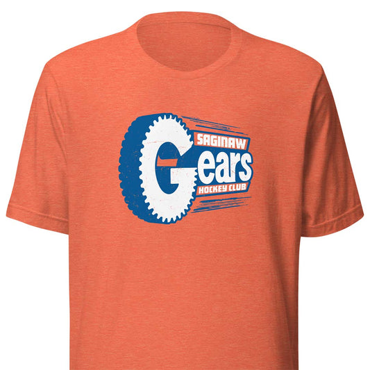A heather orange short-sleeve t-shirt featuring a large 'Saginaw Gears Hockey Club' graphic on the chest, with a blue and white gear design and white and blue lettering.