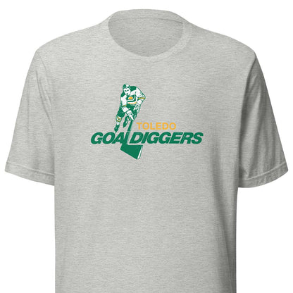 A heather gray short-sleeve crewneck t-shirt featuring a 'Toledo Goal Diggers' graphic on the chest with a football player and a green map outline.