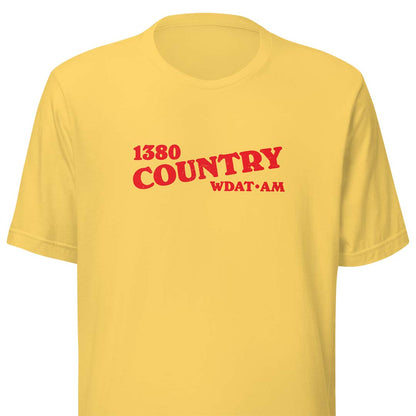 A yellow short-sleeve crewneck t-shirt with red text on the chest reading '1380 COUNTRY WDAT AM'.