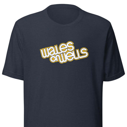 A navy blue short-sleeve t-shirt with a retro-style graphic on the chest reading 'wales on wells' in white bubble letters with a yellow outline.
